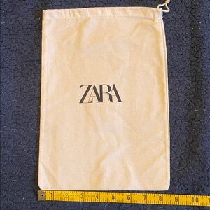 Zara Cream Drawstring Pouch with Black Logo